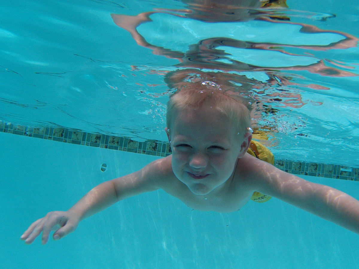 boy swimming underwater